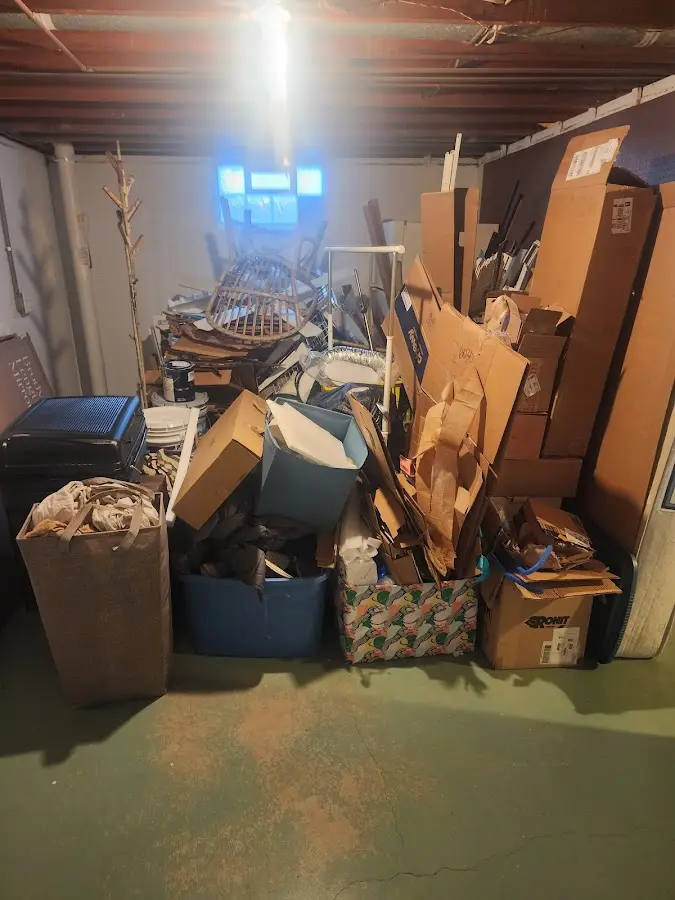 Roll-off dumpster container at job site for 2 Yard Dumpster Rental in Clayton